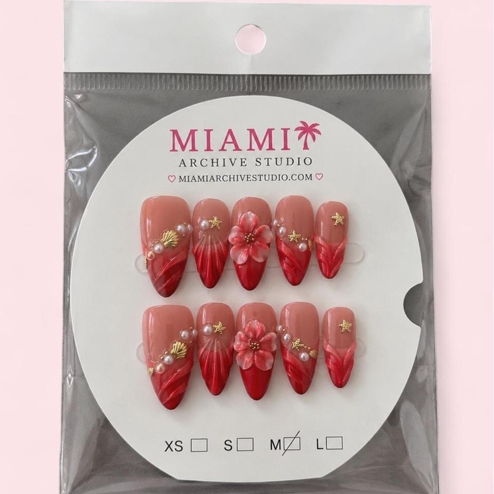 red and pink floral press-on nails with gold stars and pearls